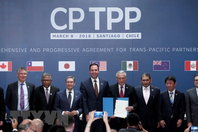Đại diện các nước tham gia lễ ký Hiệp định CPTPP chụp ảnh chung tại hội nghị ở Santiago ngày 8/3. (Nguồn: AFP/TTXVN)